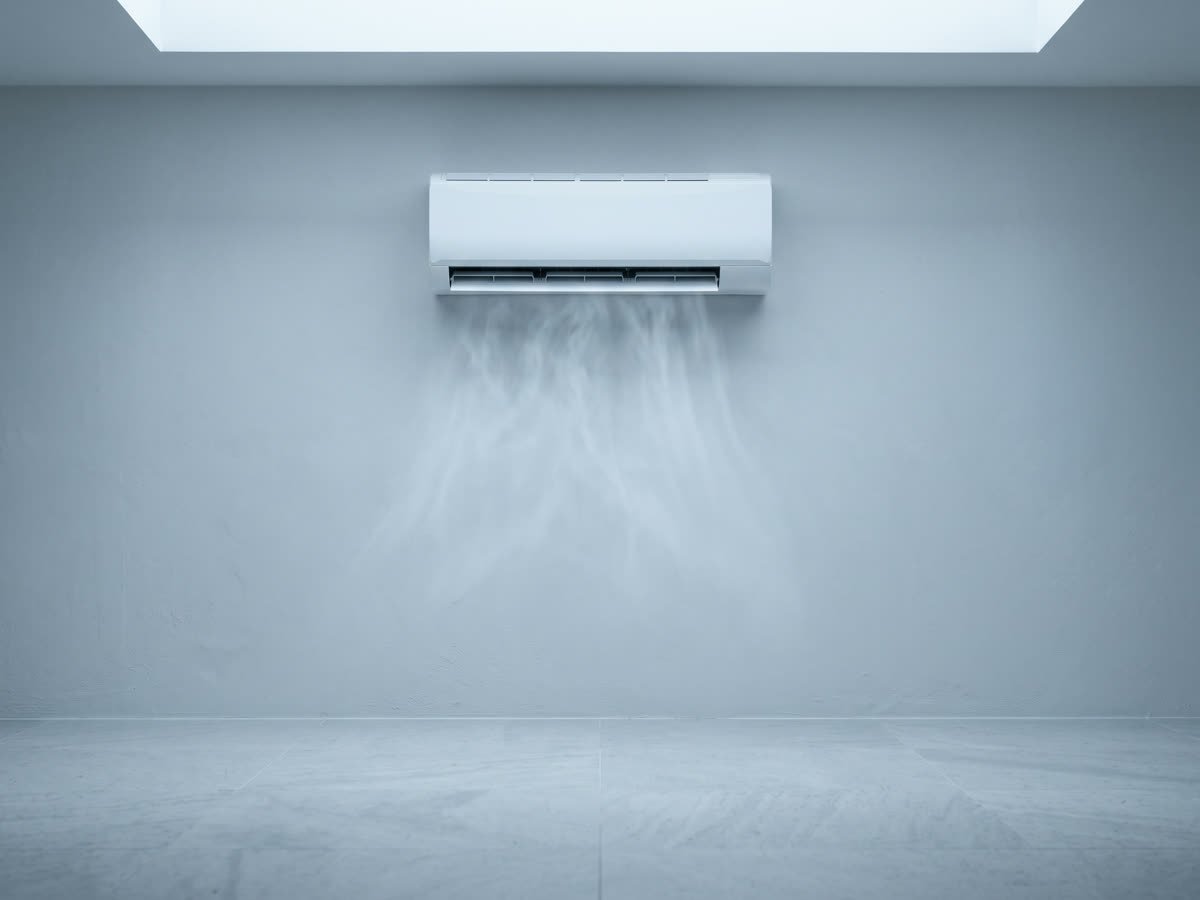 A split air conditioner unit on a pale wall
