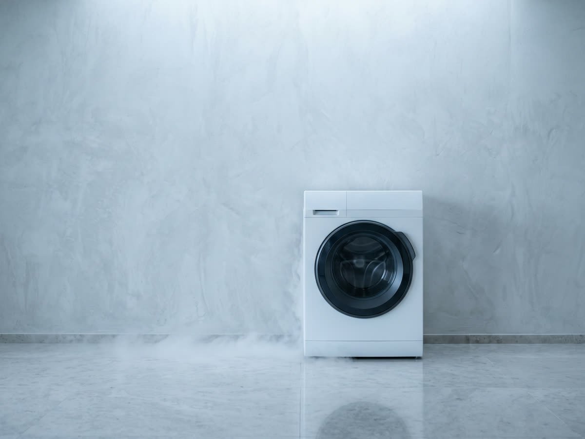 A front-load washing machine in a clean home utility room